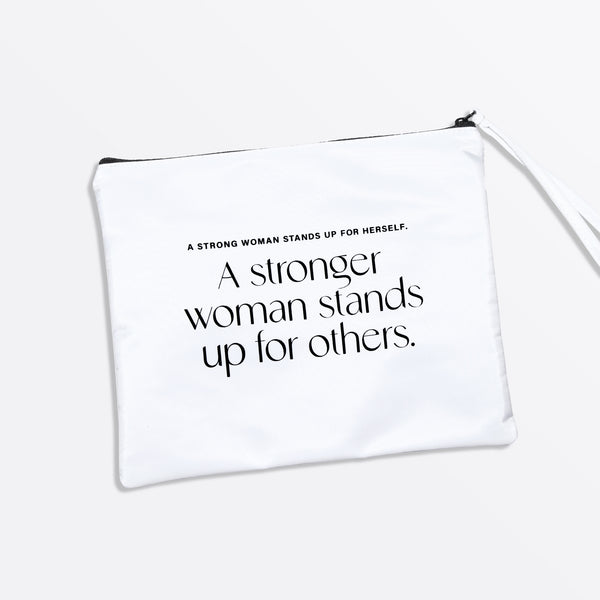 A white bag that says "A strong woman stands up for herself. A stronger woman stands up for others."