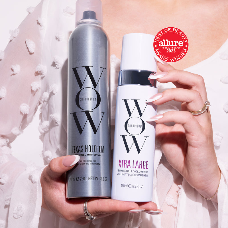 Color Wow Texas Hold ‘Em Big Hold Hairspray and Xtra Large Bombshell Volumizer held in hands with manicured nails, featuring Allure Best of Beauty Award Winner 2023 seal.
