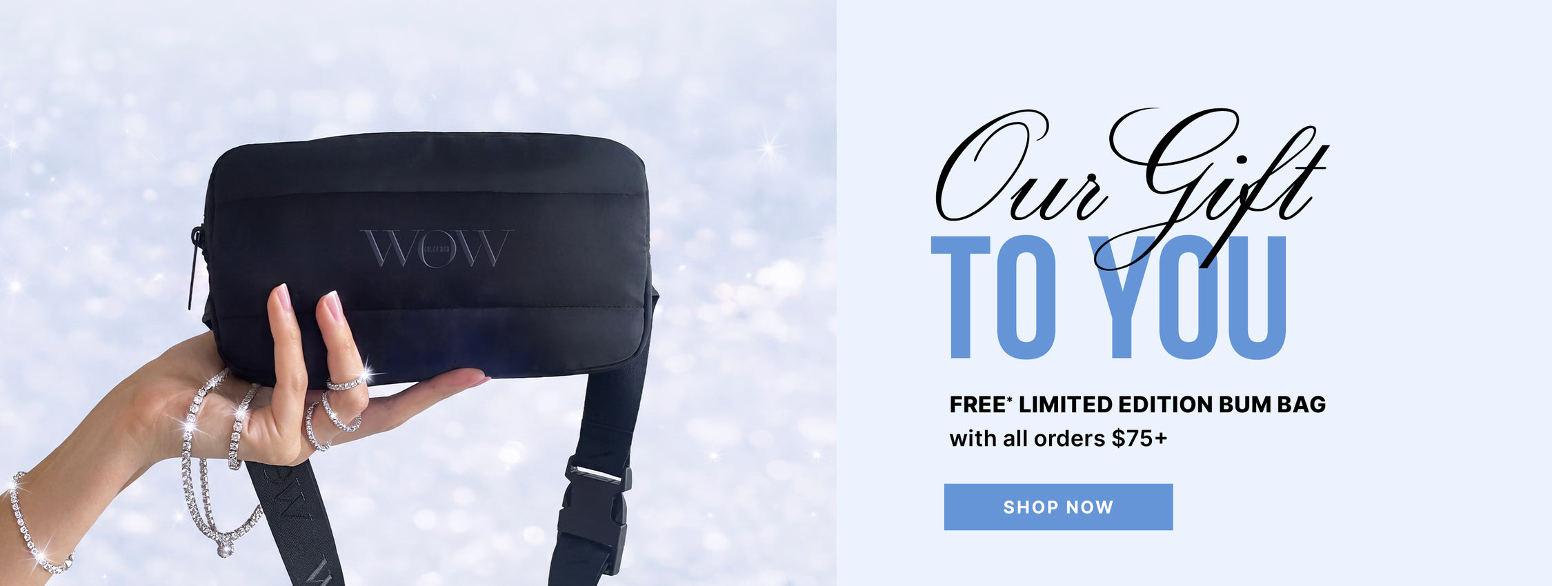 A hand holding a black Color Wow bum bag against a sparkling background. Text: Our Gift to You—free limited-edition bum bag with all orders of $75 or more. Shop now.