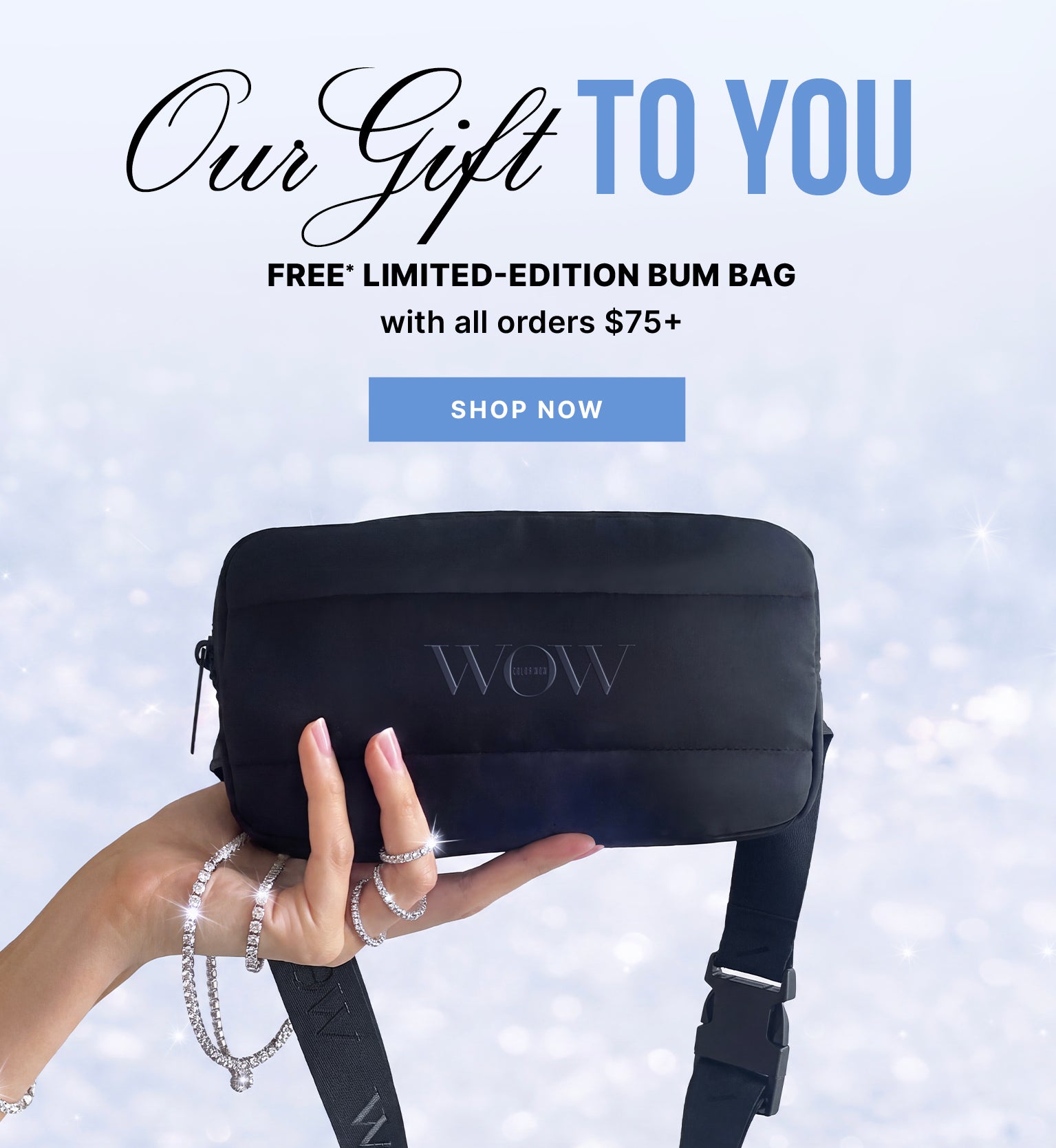 A hand holds a black Color Wow bum bag against a pale, sparkling background. Text reads: Our Gift to You, Free* limited-edition bum bag with all orders $75+, and Shop Now.