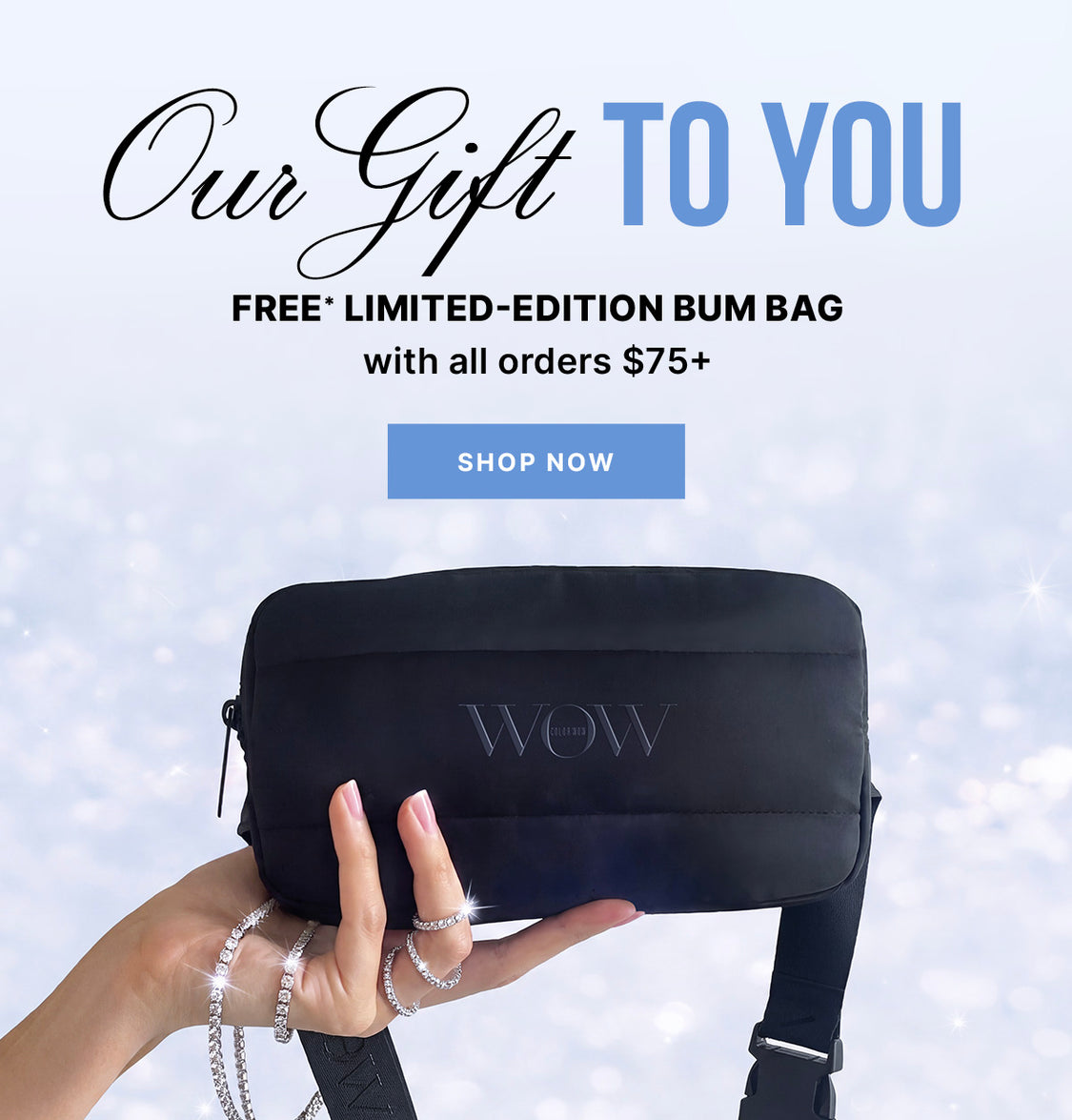 A hand holds a black Color Wow bum bag against a pale, sparkling background. Text reads: Our Gift to You, Free* limited-edition bum bag with all orders $75+, and Shop Now.