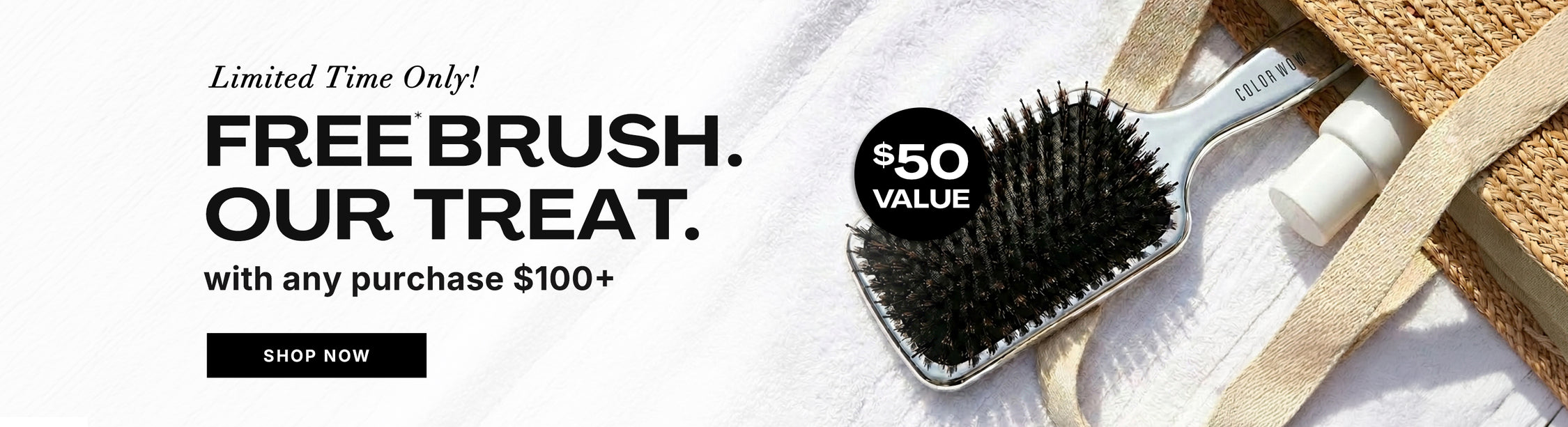 Color Wow Free Brush horizontal promotional banner. Offer: Get a free brush valued at 50 dollars with any purchase of 100 dollars or more. Visual displays a silver paddle brush next to a straw beach bag on a white towel. Includes a Shop Now button.