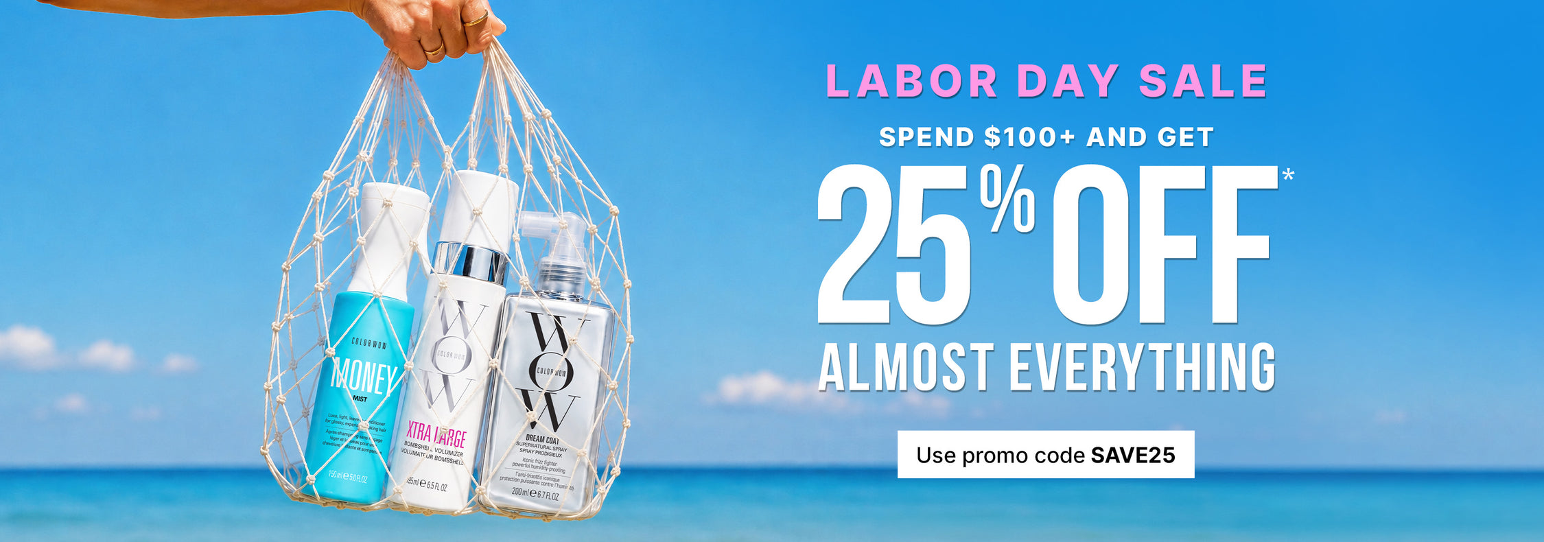Labor Day Sale: Spend $100+ and get 25% off almost everything. Use promo code SAVE25. Hand holding a net bag containing three Color Wow hair care products against a beach and ocean background.