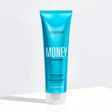 Blue shampoo bottle labeled 'Color Wow Money Laundering Hydrating Shampoo' on a white background